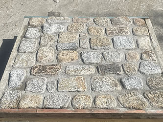 Cornish granite cobbles cemented in a frame